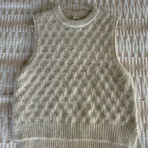 Cozy Cream Sleeveless Sweater Vest (New without tags) fits more like a small